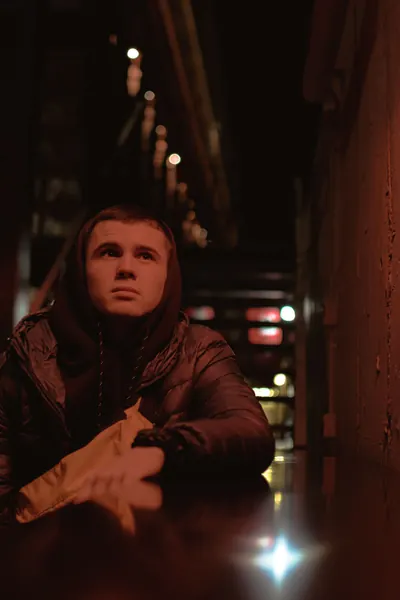 Red-lit alley portrait