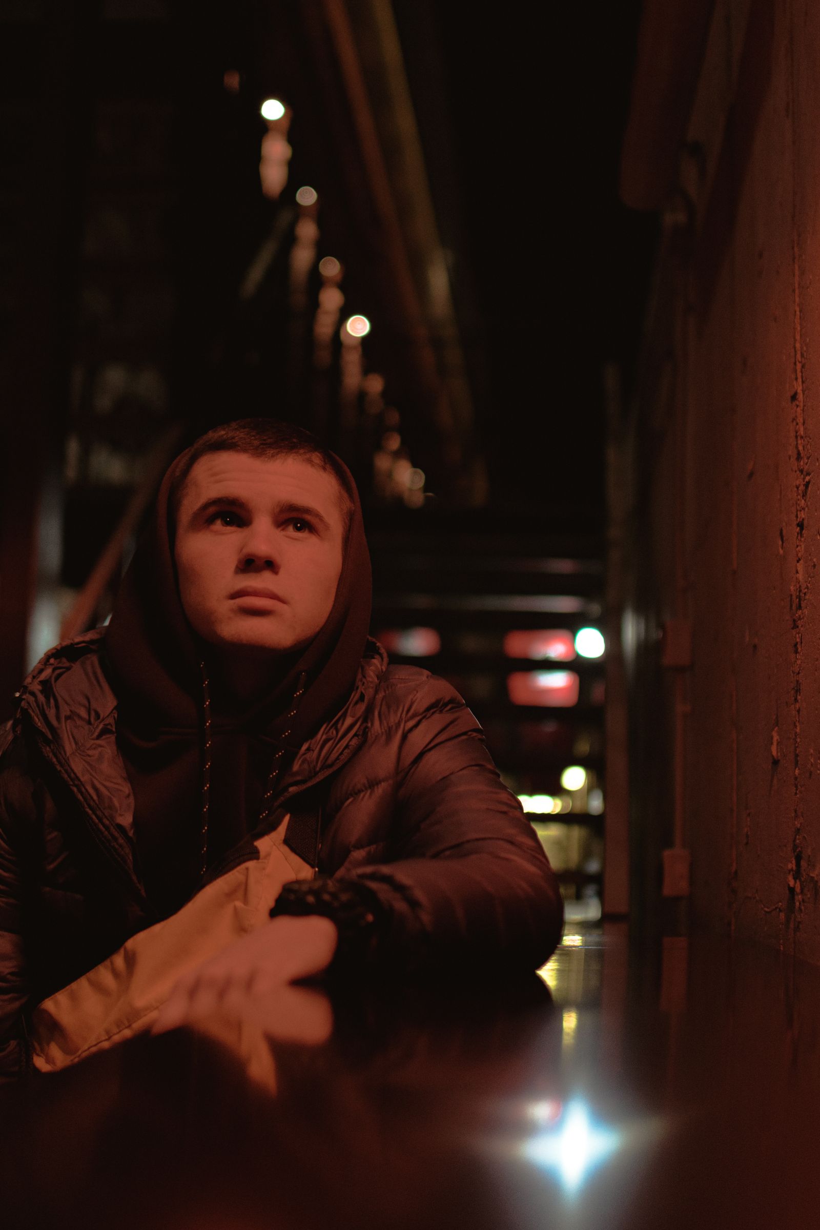 Red-lit alley portrait